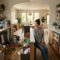 Split-screen family home with cluttered chaotic room on one side and organized functional storage system on the other
