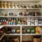 Budget-friendly organized pantry with clear bins, labeled shelves, stackable containers, and family-friendly food storage solutions.
