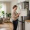 A modern family standing in a clean and organized home holding a weekly cleaning schedule, representing stress-free home management and daily cleaning routine planning.