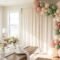 Elegant baby shower decorations for home in a bright living room with linen backdrop and matte balloons