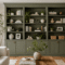 IKEA Billy bookcase built-in hack with green paint and brass hardware